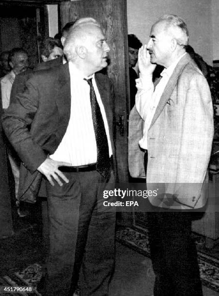 Georgian leader Eduard Shevardnadze listens to the Deputy Chairman of Sukhumi's city government Lorik Marshani after his arrival to Sukhumi, Georgia,...