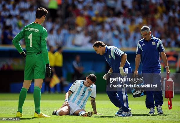 Angel Di Maria of Argentina lies injured during the 2014 FIFA World Cup Brazil Quarter Final match between Argentina and Belgium at Estadio Nacional...