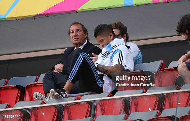 Former head coach of Argentina Carlos Bilardo and Marcos Rojo of Argentina attend the 2014 FIFA World Cup Brazil Quarter Final match between...