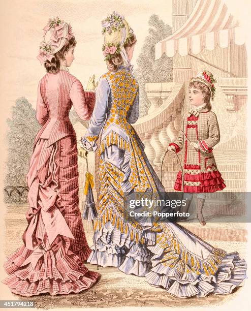 French vintage fashion illustration featuring two stylish ladies and a young girl with a hoop in parkland setting, published in Paris, circa 1870.