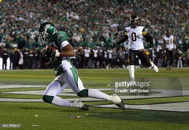 Wide receiver Geroy Simon of the Saskatchewan Roughriders catches a touchdown pass against the Hamilton Tiger-Cats in the first quarter during the...