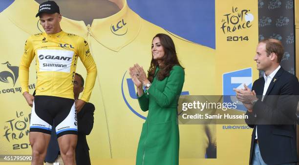 Catherine, Duchess of Cambridge and Prince William, Duke of Cambridge present the yellow jersey to winner Marcel Kittel at the finish of Stage 1 of...