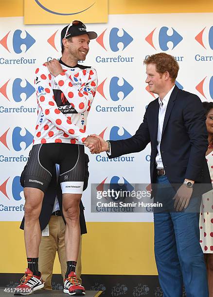 Prince Harry presents Jens Voigt with the King of the Mountains jersey at the finish of Stage 1 of the Tour de France on July 5, 2014 at Harrogate,...