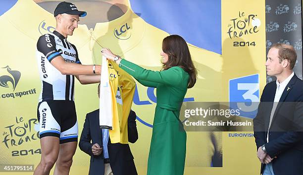 Catherine, Duchess of Cambridge and Prince William, Duke of Cambridge present the yellow jersey to winner Marcel Kittel at the finish of Stage 1 of...