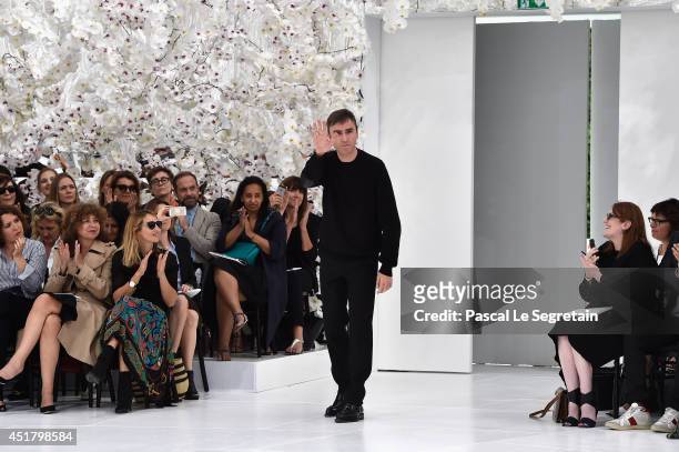 Designer Raf Simons acknowledges the applause of the audience after the Christian Dior show as part of Paris Fashion Week - Haute Couture Fall/Winter...