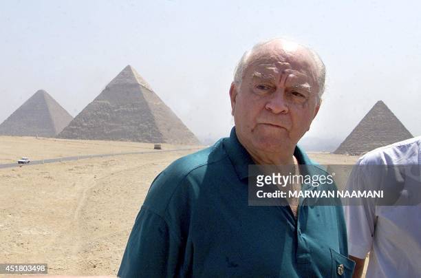 Real Madrid former player Alfredo Di Stefano poses for a picture in front of Egypt's Giza pyramids south of Cairo 04 August 2001. Di Stefano, one of...