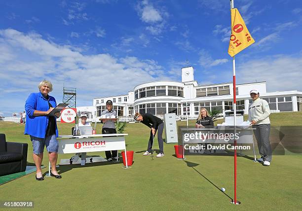 Michelle Wie of the USA the 2014 US Open Champion practices her putting in front of Laura Davies of England, Paula Creamer of the USA, Lydia Ko of...