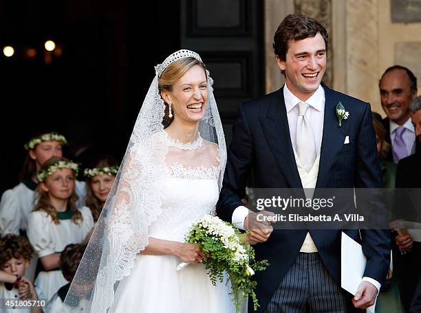 Prince Amedeo of Belgium and Elisabetta Maria Rosboch von Wolkenstein celebrate after their wedding ceremony at Basilica Santa Maria in Trastevere on...