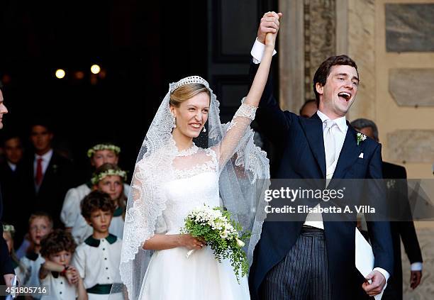 Prince Amedeo of Belgium and Elisabetta Maria Rosboch von Wolkenstein celebrate after their wedding ceremony at Basilica Santa Maria in Trastevere on...