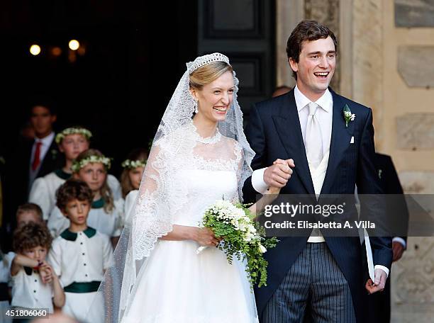 Prince Amedeo of Belgium and Elisabetta Maria Rosboch von Wolkenstein celebrate after their wedding ceremony at Basilica Santa Maria in Trastevere on...