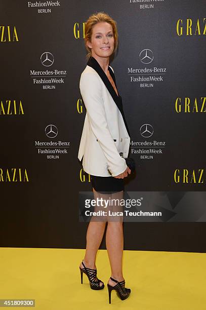 Lisa Martinek arrives for the Opening Night by Grazia fashion show during the Mercedes-Benz Fashion Week Spring/Summer 2015 at Erika Hess Eisstadion...