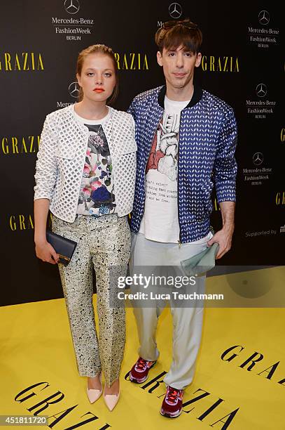 Jella Haase and designer Kilian Kerner arrive for the Opening Night by Grazia fashion show during the Mercedes-Benz Fashion Week Spring/Summer 2015...