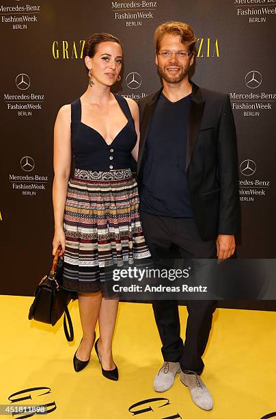 Kai Rose an Lena Hoschek arrive for the Opening Night by Grazia fashion show during the Mercedes-Benz Fashion Week Spring/Summer 2015 at Erika Hess...