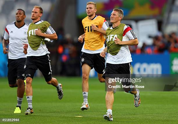 Bastian Schweinsteiger of Germany runs during the German national team training at Estadio Mineirao on July 7, 2014 in Belo Horizonte, Brazil.