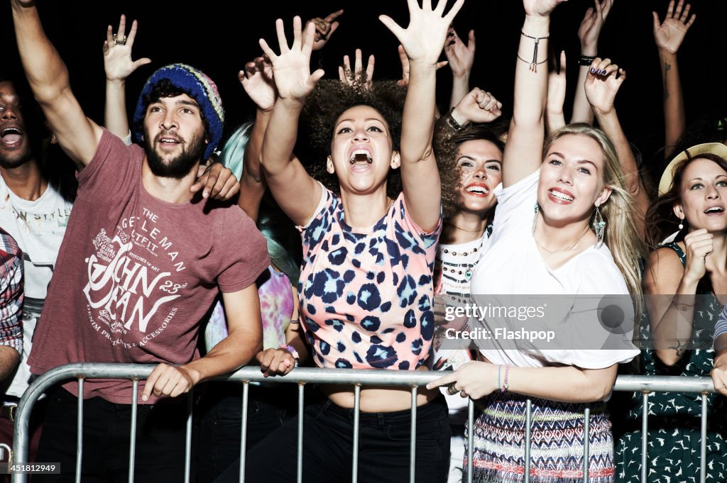 Group of people having fun at music concert