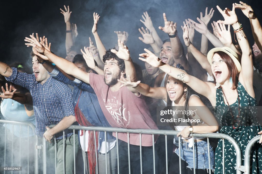 Group of people having fun at music concert