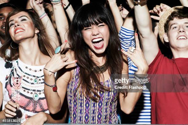 group of people having fun at music concert - man fringe stock pictures, royalty-free photos & images