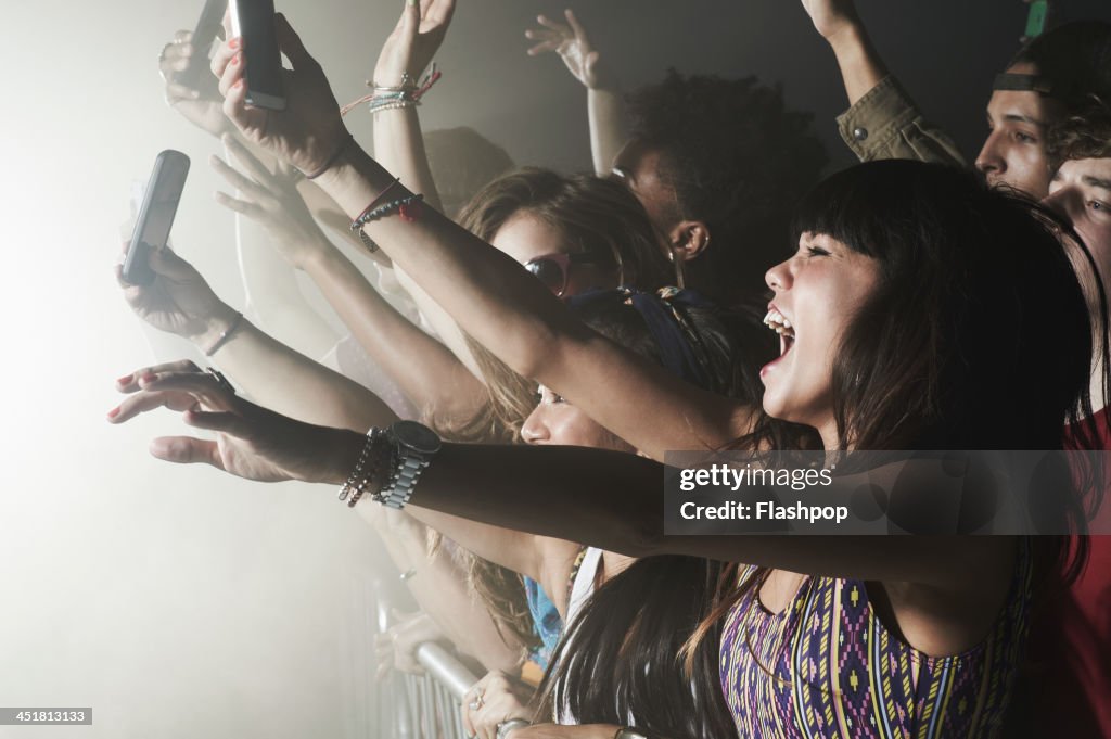 Group of people having fun at music concert