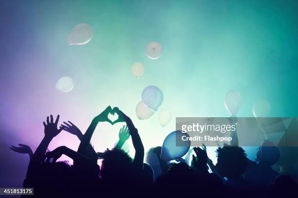 group of people having fun at music concert - music festival stock pictures, royalty-free photos & images