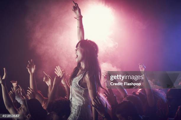 group of people having fun at music concert - concierto fotografías e imágenes de stock