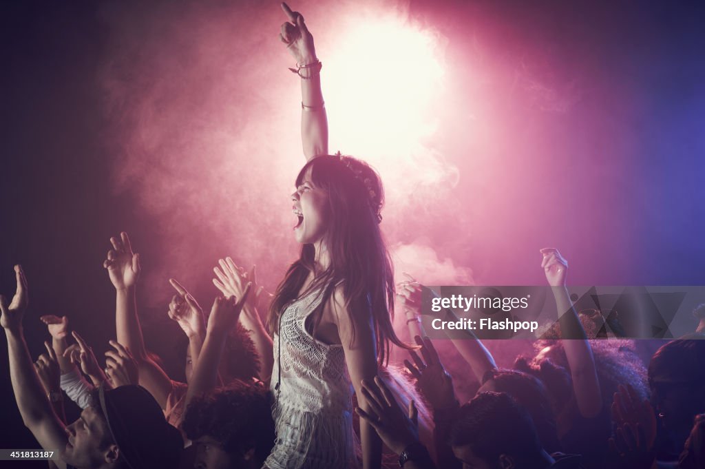 Group of people having fun at music concert