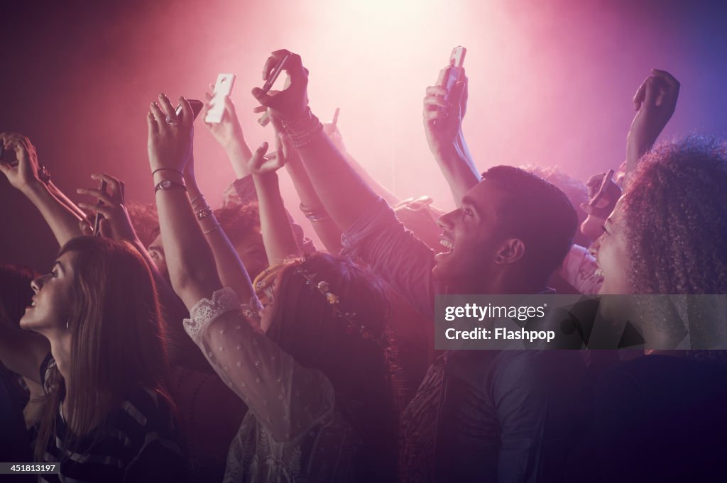 Group of people having fun at music concert