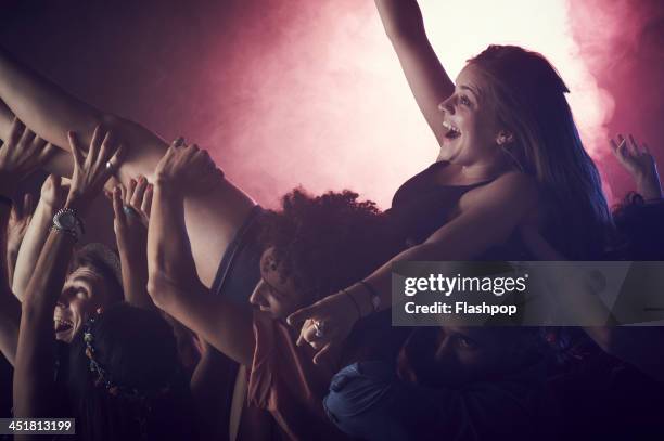 group of people having fun at music concert - crowd surfing bildbanksfoton och bilder