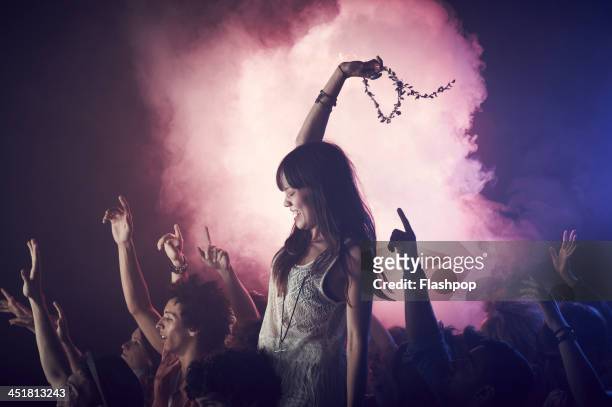 group of people having fun at music concert - concert lights stock pictures, royalty-free photos & images
