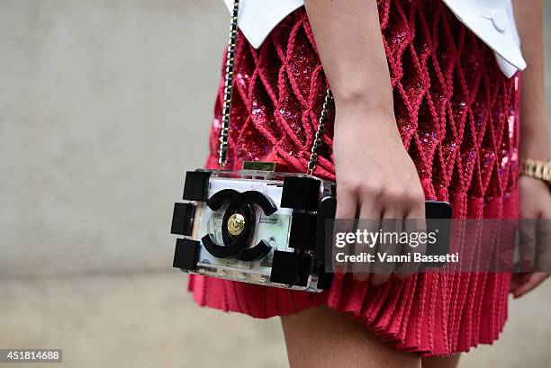 Inga Kozel poses wearing Azzedina Alaia Couture top and skirt and Chanel clutch after Dior show on July 7, 2014 in Paris, France.