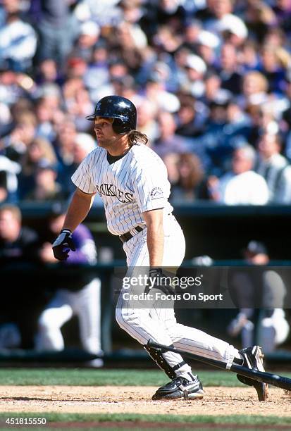 Dante Bichette of the Colorado Rockies bats during an Major League Baseball game circa 1995 at Coors Field in Denver, Colorado. Bichette played for...