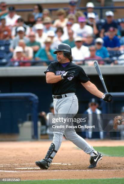 Dante Bichette of the Colorado Rockies bats against the Seattle Mariners during an Major League Baseball spring training game circa 1996 at Peoria...