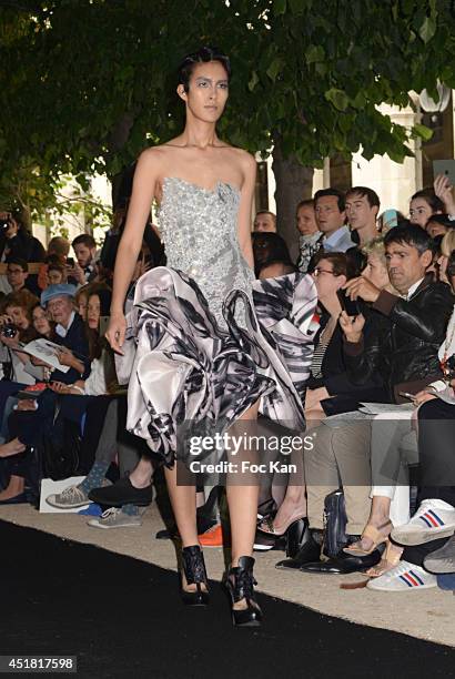 Model walks the runway during the On Aura Tout Vu Show as part of Paris Fashion Week - Haute Couture Fall/Winter 2014-2015 at Palais Royal on July 7,...