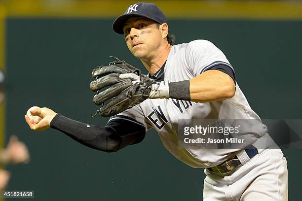 Second baseman Brian Roberts of the New York Yankees throws out Jason Kipnis of the Cleveland Indians at first base during the sixth inning at...