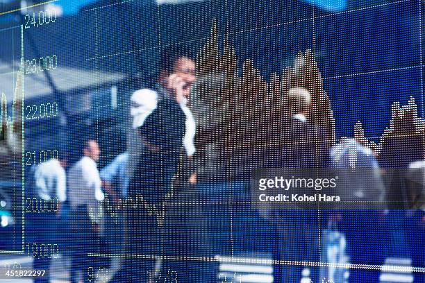stock price chart and business men - economia foto e immagini stock
