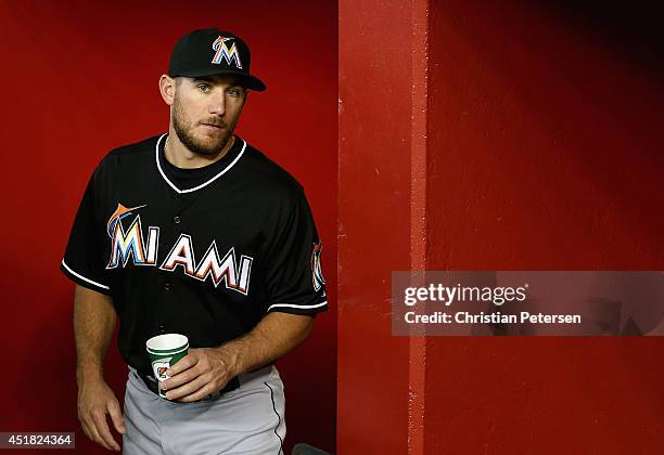 Jeff Mathis of the Miami Marlins walks through the dugout before the MLB game against the Arizona Diamondbacks at Chase Field on July 7, 2014 in...