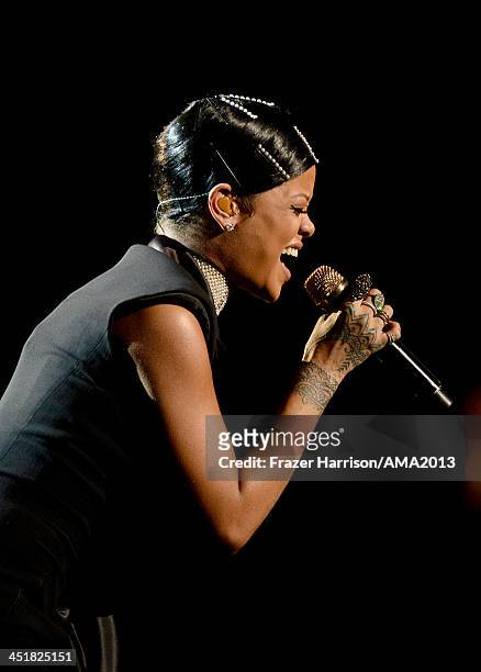 Singer Rihanna performs onstage during the 2013 American Music Awards at Nokia Theatre L.A. Live on November 24, 2013 in Los Angeles, California.
