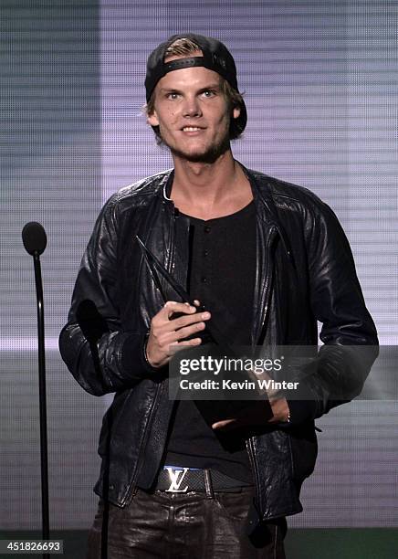 Musician Avicii accepts the Favorite Electronic Dance Music Artist award onstage during the 2013 American Music Awards at Nokia Theatre L.A. Live on...