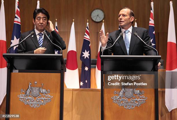 Japanese Prime Minister Shinzo Abe addresses the Australian Government in the House of Representatives with Australian Prime Minister Tony Abbott at...