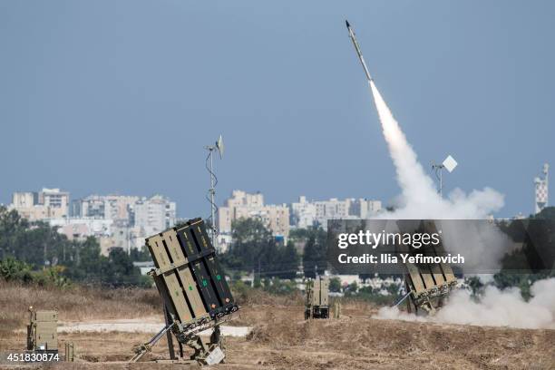 The Iron Dome air-defense system fires to intercept a rocket over the city of Ashdod on July 8 in Ashdod, Israel. Due to recent escalation in the...