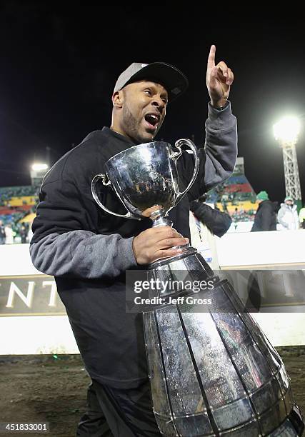 Saskatchewan Roughriders head coach Corey Chamblin celebrates with the Grey Cup following his teams 45-23 victory over the Hamilton Tiger-Cats during...