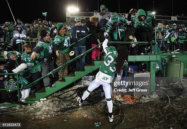 Dwight Anderson of the Saskatchewan Roughriders celebrates with fans following his teams 45-23 victory over the Hamilton Tiger-Cats during the 101st...