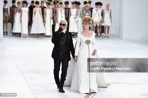 Fashion designer Karl Lagerfeld and Ashleigh Good aknowledge the applause of the audience after the Chanel show as part of Paris Fashion Week - Haute...