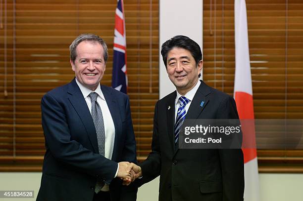 Japanese Prime Minister Shinzo Abe shakes hands with Opposition leader Bill Shorten at Parliament House on July 8, 2014 in Canberra, Australia. The...