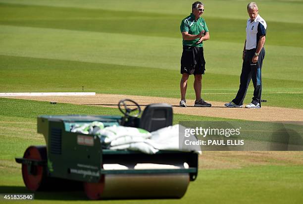 England coach Peter Moores speaks to a groundsman during a team practice session at Trent Bridge in Nottingham in central England, on July 8 ahead of...