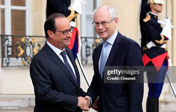 French President Francois Hollande welcomes European Council President Herman Van Rompuy prior a meeting at the Elysee Palace on July 8 in Paris,...