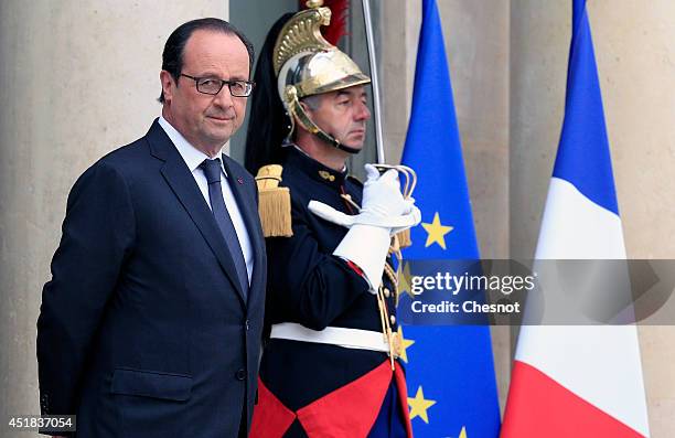 French President Francois Hollande waits before a meeting with European Council President Herman Van Rompuy at the Elysee Palace on July 8, 2014 in...