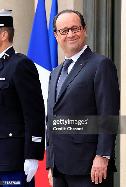 French President Francois Hollande waits before a meeting with European Council President Herman Van Rompuy at the Elysee Palace on July 8, 2014 in...