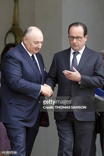 The head of the European Jewish Congress, Moshe Kantor , shakes hands with French President Francois Hollande on July 8, 2014 after their meeting at...