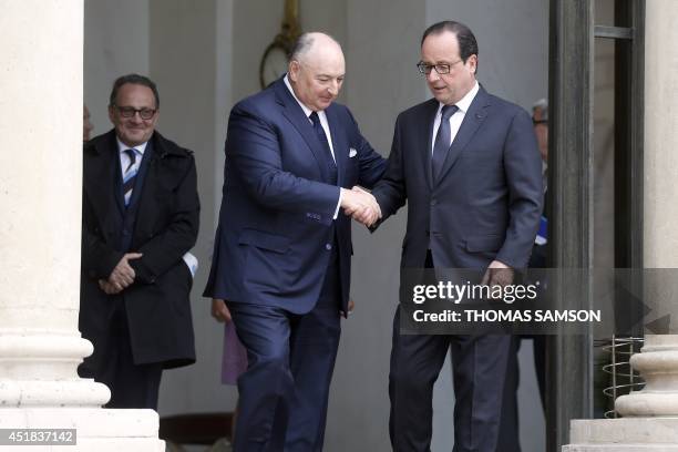 The head of the European Jewish Congress, Moshe Kantor , shakes hands with French President Francois Hollande on July 8, 2014 after their meeting at...