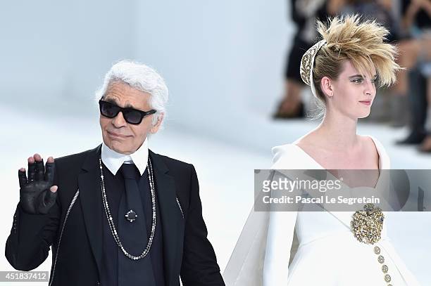 Fashion designer Karl Lagerfeld and model Ashleigh Good aknowledge the applause of the audience after the Chanel show as part of Paris Fashion Week -...